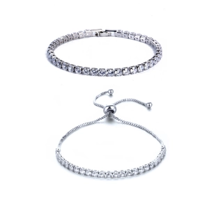 Close-up of silver tennis bracelet with round cubic zirconia and adjustable bolo clasp