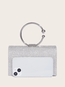 Detailed view of silver rhinestone evening clutch bag with circular handle and phone reference