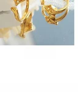 Close-up of 18K gold-plated snake chain bracelet with detailed fox head design charm