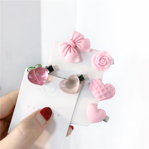 Pink hair clip set featuring sweet bow, peach, and flower designs for women and girls