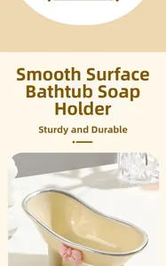 Close-up of beige bathtub soap dish with pink bow and silver trim on a clean surface