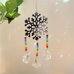 Detailed silver snowflake ornament with colorful crystal beads and clear prism drops