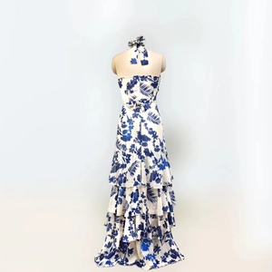 Detail of bohemian halter floral maxi dress with tiered ruffle skirt and lace-up back