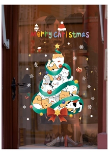 Close-up of static Christmas window stickers featuring cartoon cats and dogs as a tree
