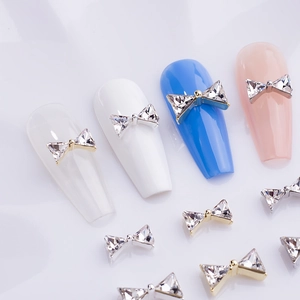 3D metallic bowknot nail charms with K9 rhinestones on long manicure tips for nail art