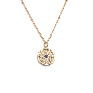 Collana a catena dorata con ciondolo occhio blu in zircone e motivo a raggiera solare