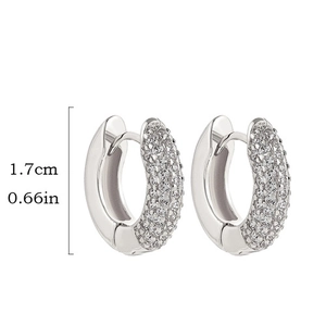 Macro shot of silver U-shaped hoop earrings with micro-pavé cubic zirconia and 1.7cm height