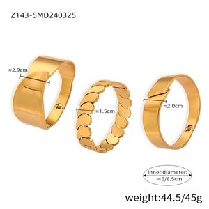 Detailed view of three 18k gold plated chunky bangles showing dimensions and textures