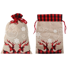 Detail of burlap Christmas gift bag with red plaid deer applique and snowflake embroidery