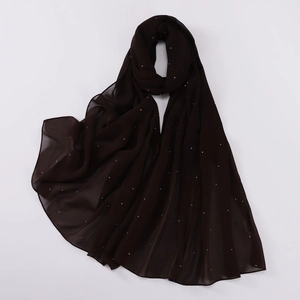 Detailed view of black pearl chiffon shawl with sparkling rhinestones embellishments
