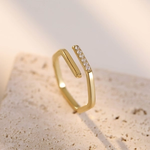 Minimalist geometric gold open ring with hexagonal profile and micro-pave crystals