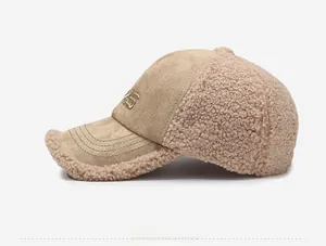Detail view showing khaki winter baseball cap with plush teddy fleece and embroidery