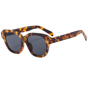 Retro small frame tortoiseshell sunglasses with silver rivets and dark grey lenses