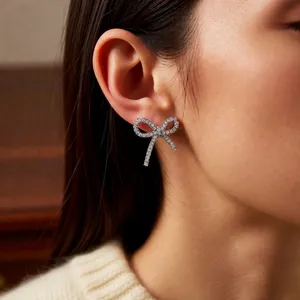 Elegant silver bow ear cuffs with sparkling zircon crystals for non-pierced ears