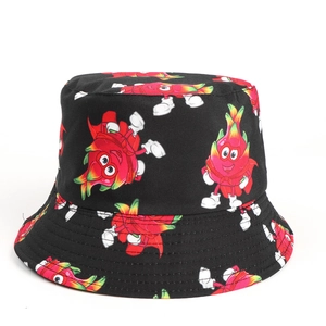 Detail view of double-sided bucket hat with vibrant dragon fruit cartoon print pattern