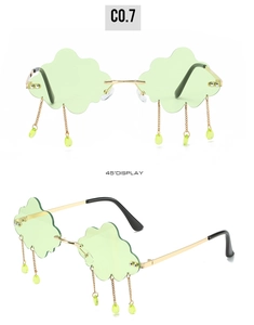 Green cloud-shaped rimless sunglasses with teardrop pendants and golden metal frames