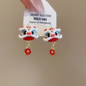 Close-up of Chinese lion dance earring with 925 silver needle and gold coin pendant