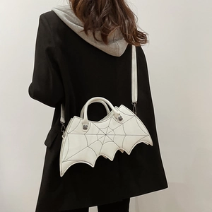 White bat wing PU leather shoulder bag with spider web embroidery and skull details