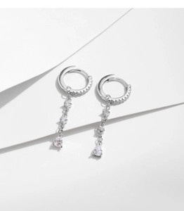 Macro shot of S925 sterling silver long tassel earrings with sparkling teardrop crystals