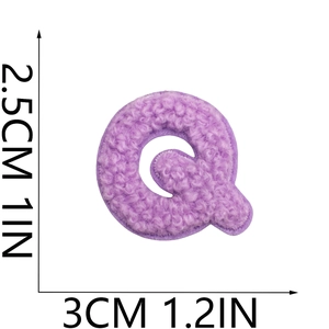 Macro shot of purple chenille letter Q patch with precise height and width measurements