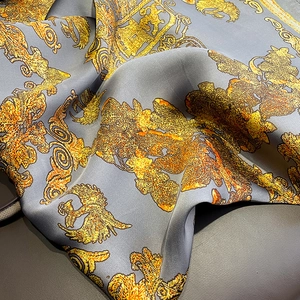 Luxurious gray silk shawl featuring elegant golden orange Baroque leaf patterns