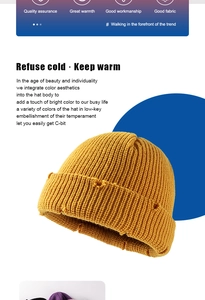 Detailed view of mustard yellow knit beanie with distressed holes and ribbed texture