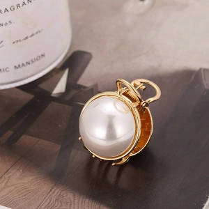 Elegant large gold metal hair claw clip with oversized white pearl detail for women