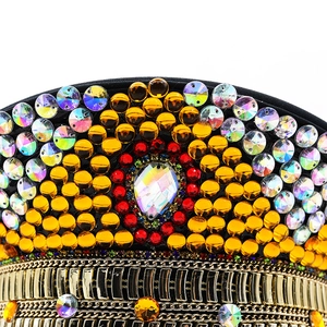 Luxurious gold captain hat featuring vibrant rhinestones and metallic chain decor