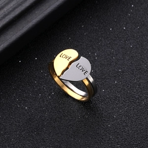 Titanium steel heart-shaped couple rings set with LOVE engraving in gold and silver