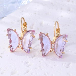 Detailed close-up of purple gradient crystal butterfly earrings with gold plating and studs