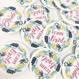 White and pink Bride to be and Team Bride tinplate badges for bridal shower parties