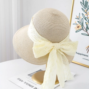 Elegant woven straw hat with large cream lace bow tie for women sun protection