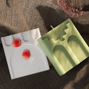 Macro detail of Roman castle silicone mold with brick wall texture and arched gate design