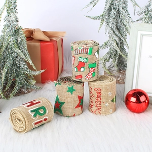 Christmas burlap ribbons with wire edges and festive prints on plush rug with decor