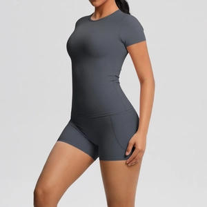 Detailed texture of charcoal grey moisture-wicking fabric on slim yoga suit set