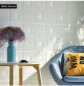 Detailed view of white 3D self-adhesive wall panels with relief floral patterns