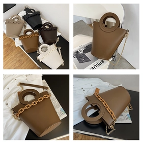 Detail of minimalist bucket bags with round handles and chunky chain decor in multiple colors