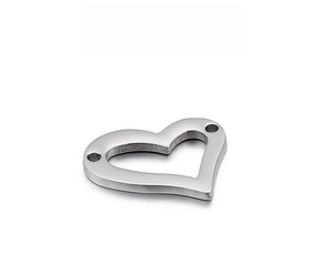 Detailed macro view of heart-shaped stainless steel pendant with fine brushed metal texture