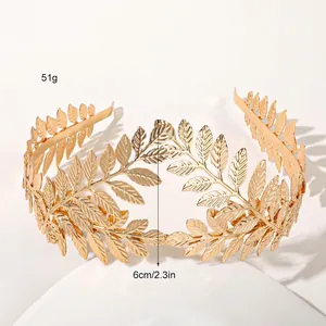 Detail view of gold metal leaf headband showing 6cm height and 51g weight specs