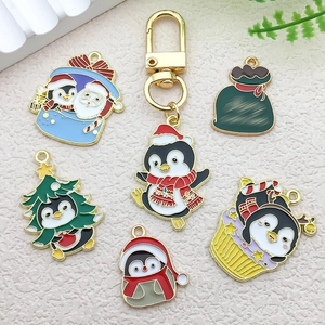 Christmas penguin enamel charms set in various holiday designs with gold alloy plating