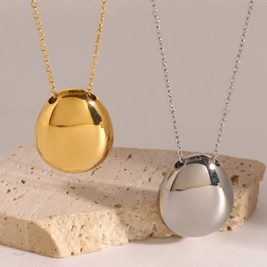 Polished pebble-shaped pendant necklaces in gold and silver finish with sleek chains