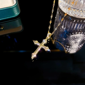 Polished 18K gold plated stainless steel cross pendant necklace with sparkling cubic zirconia