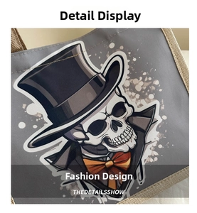 Detail of gothic skull print with top hat and woven jute trim on a canvas tote bag