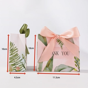 Pink paper wedding candy box with leaf prints, ribbons, and 11.5x4.5x10cm dimensions