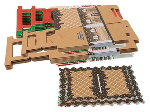 Flat lay of unassembled kraft paper gingerbread house Christmas candy boxes with handles