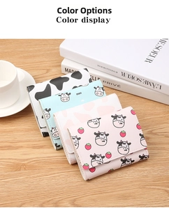 Close-up of four cute cow print and strawberry pattern mini tri-fold faux leather wallets