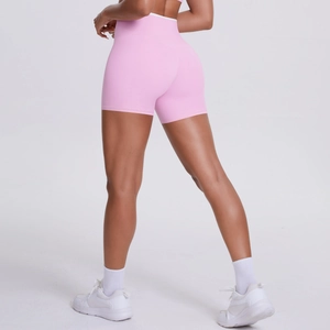Rear view of pink high-waisted yoga shorts with white contrast waistband on fitness model