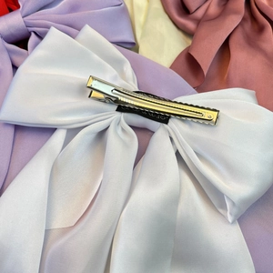 Elegant large white satin ribbon bow hair clip with long streamer and metal alligator clip