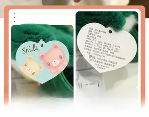 Detail of 10cm green plush parrot keychain with spandex soft fabric and heart-shaped tag