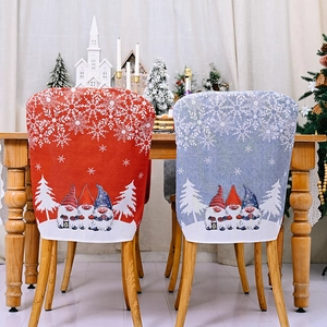 Detail of Christmas chair covers featuring Nordic gnomes and white snowflake patterns